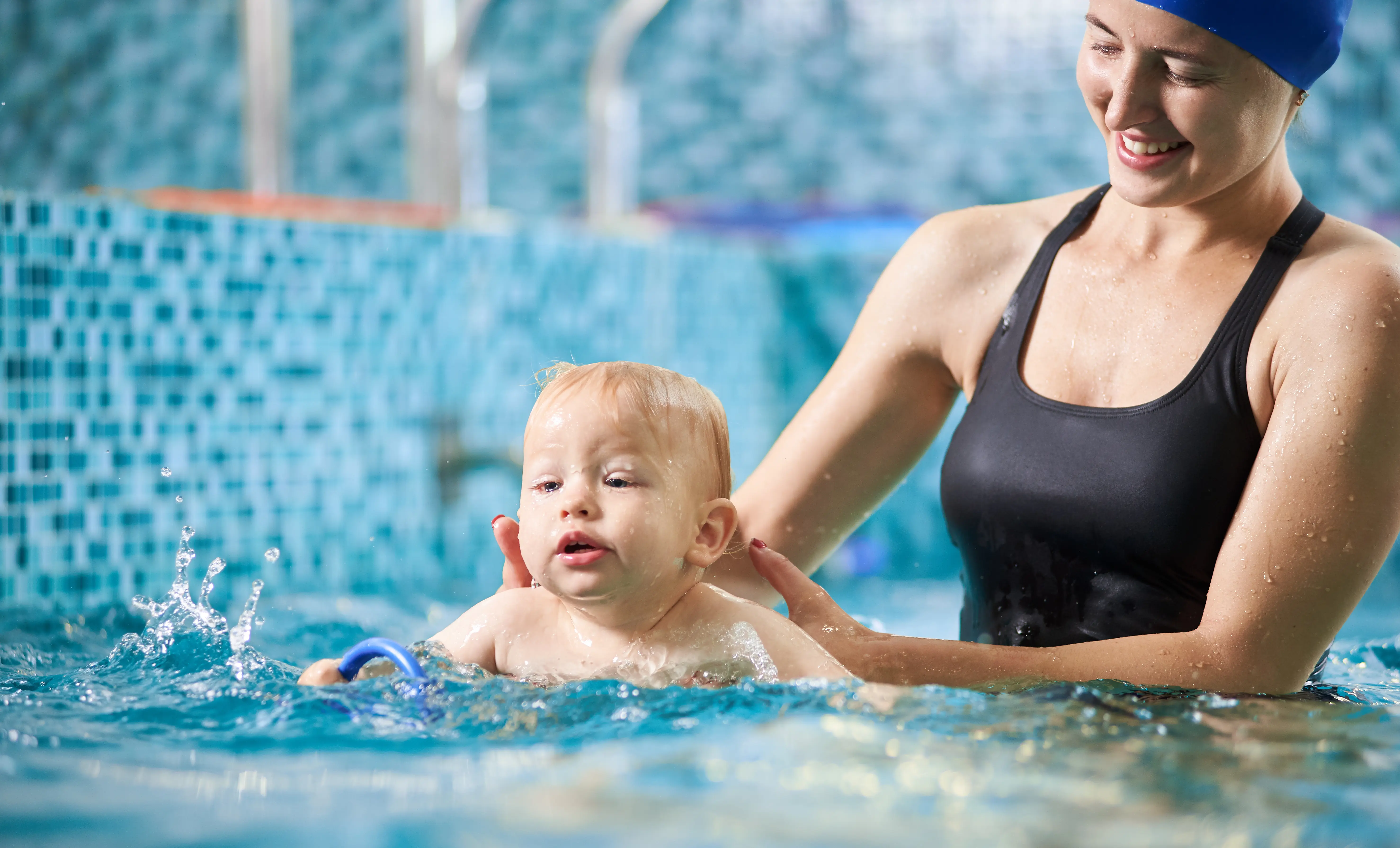 Infant in pool with parent